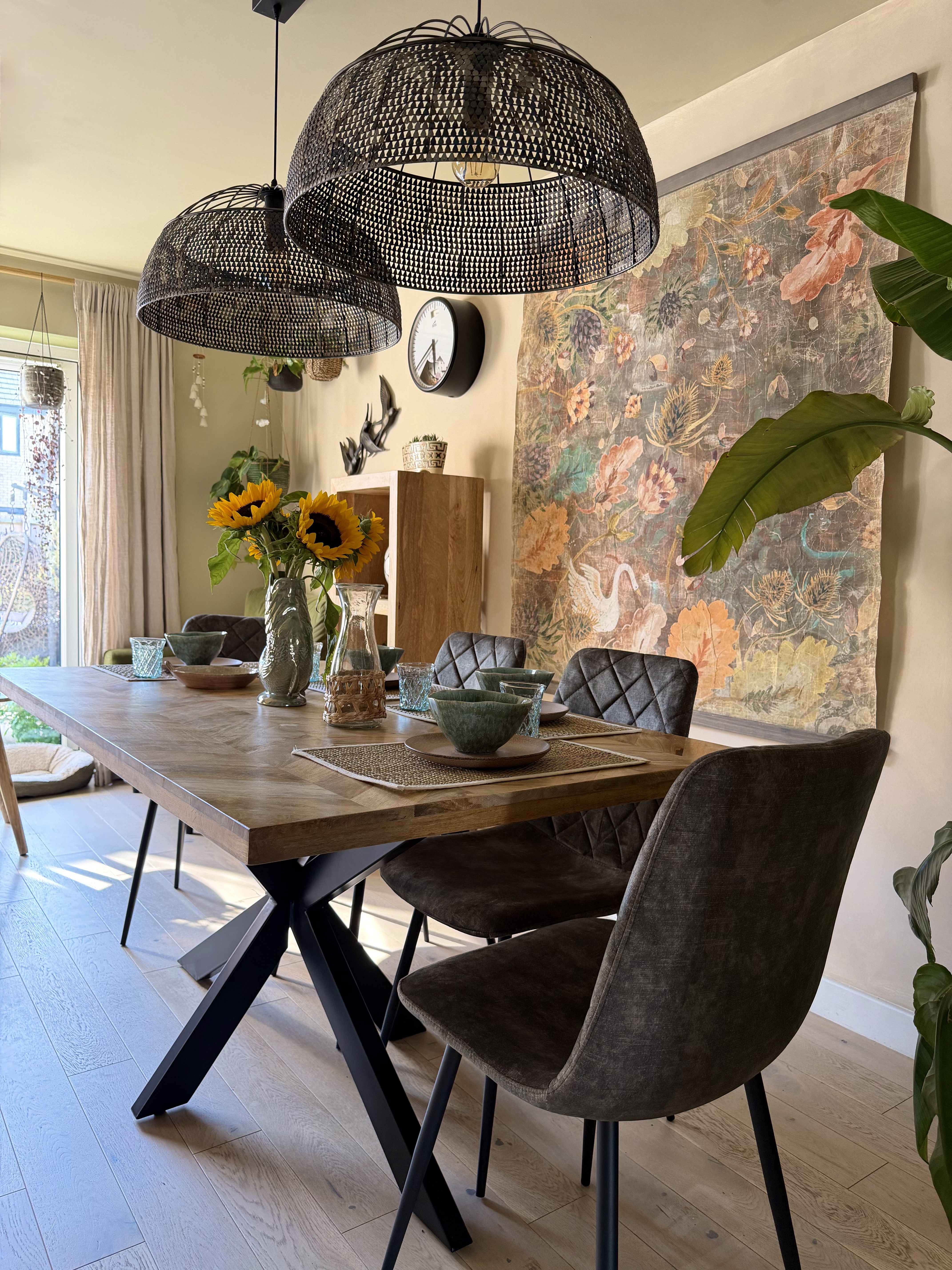 Dining room styled for FW Homestores — sunflowers, pendant lamps and botanical artwork